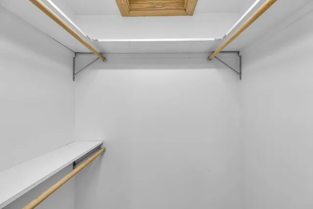 a bathroom with a granite countertop sink mirror toilet and bathtub