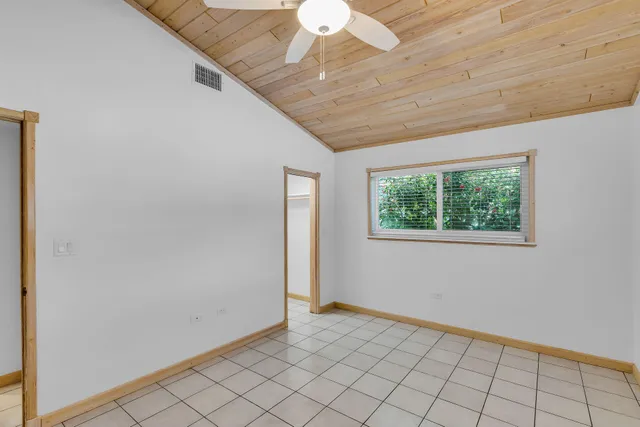 an empty room with closet area