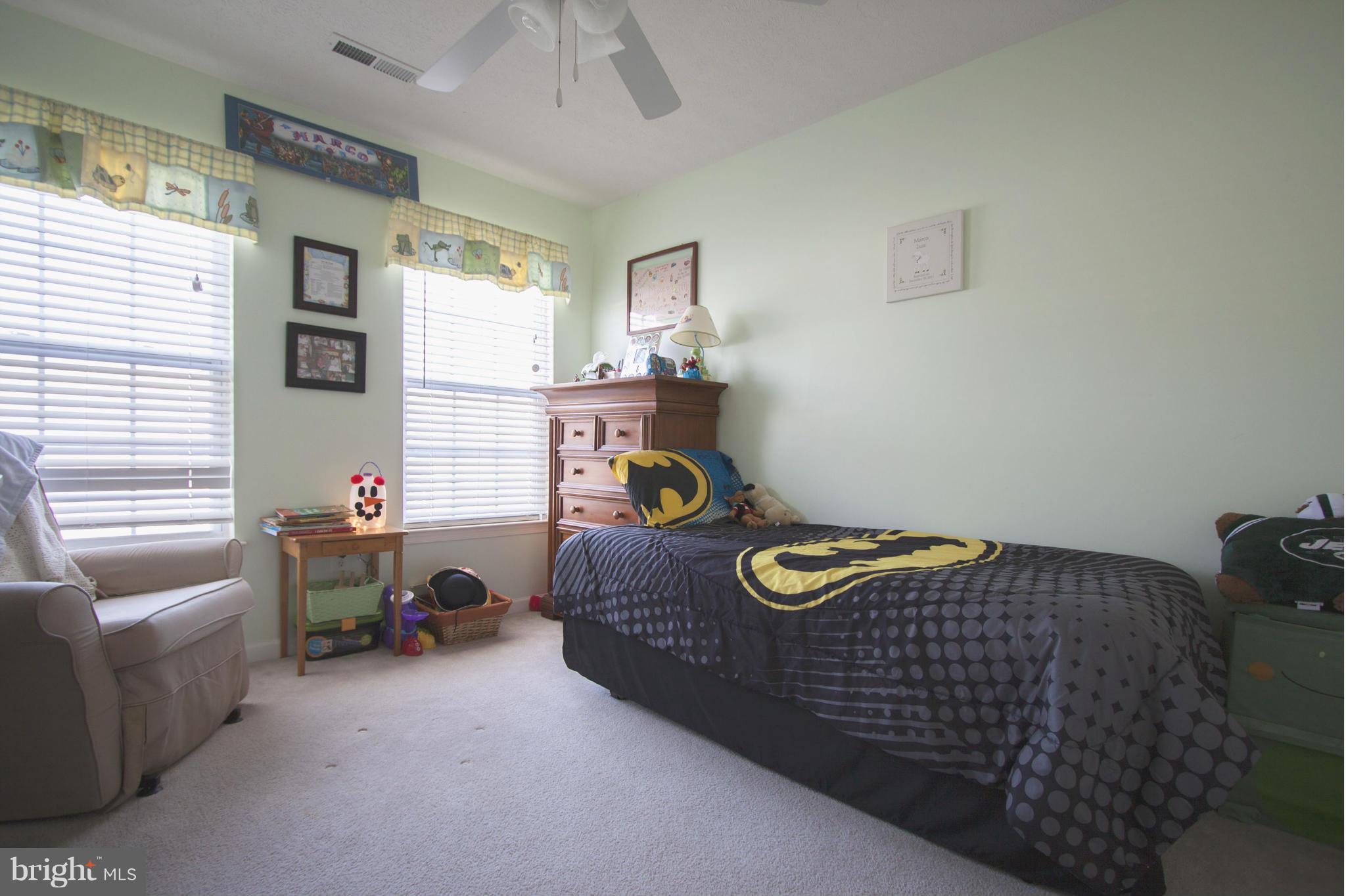 9653 Biggs Road Baltimore, MD 21220 - Photo 12 of 22 a bedroom with a bed and a couch