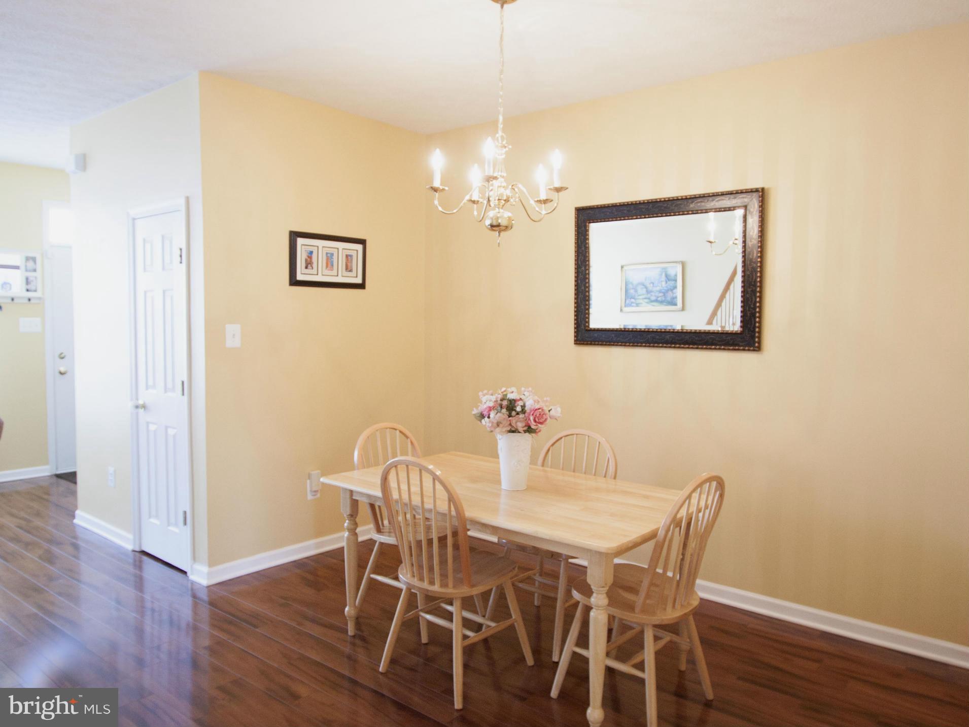 9653 Biggs Road Baltimore, MD 21220 - Photo 16 of 22 a view of a dining room with furniture and wooden floor