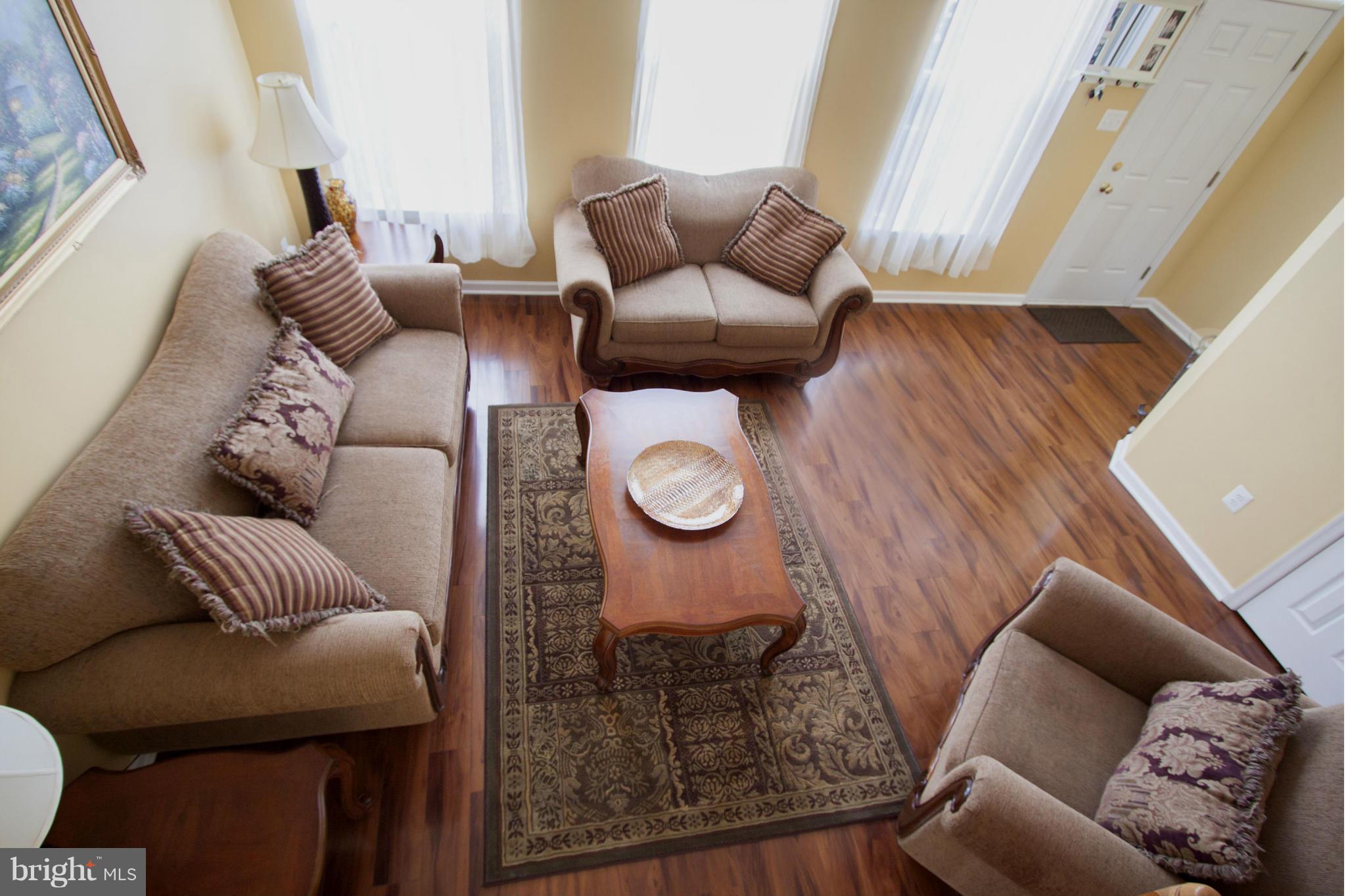 9653 Biggs Road Baltimore, MD 21220 - Photo 17 of 22 a living room with furniture and wooden floor
