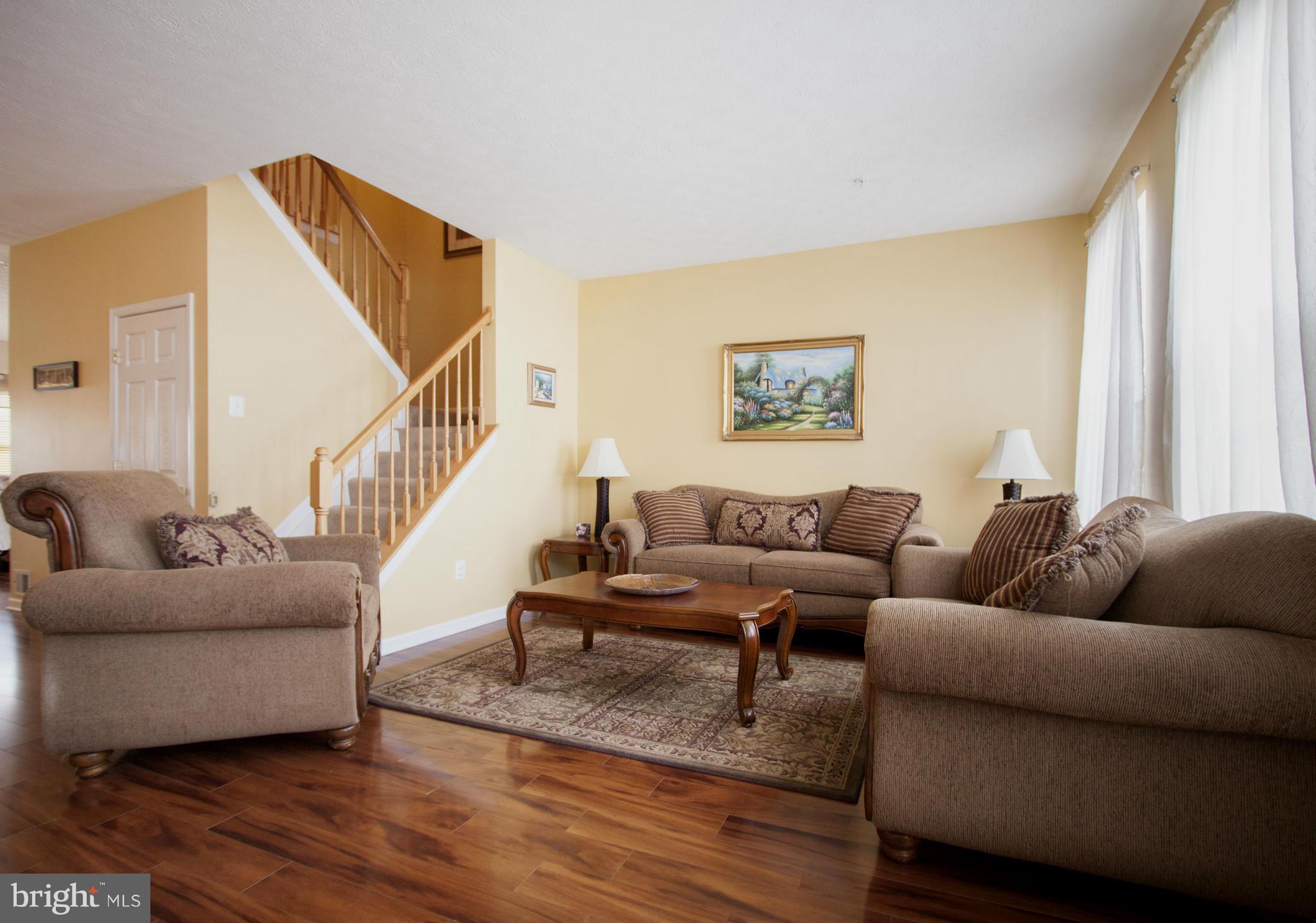 9653 Biggs Road Baltimore, MD 21220 - Photo 18 of 22 a living room with furniture and a wooden floor