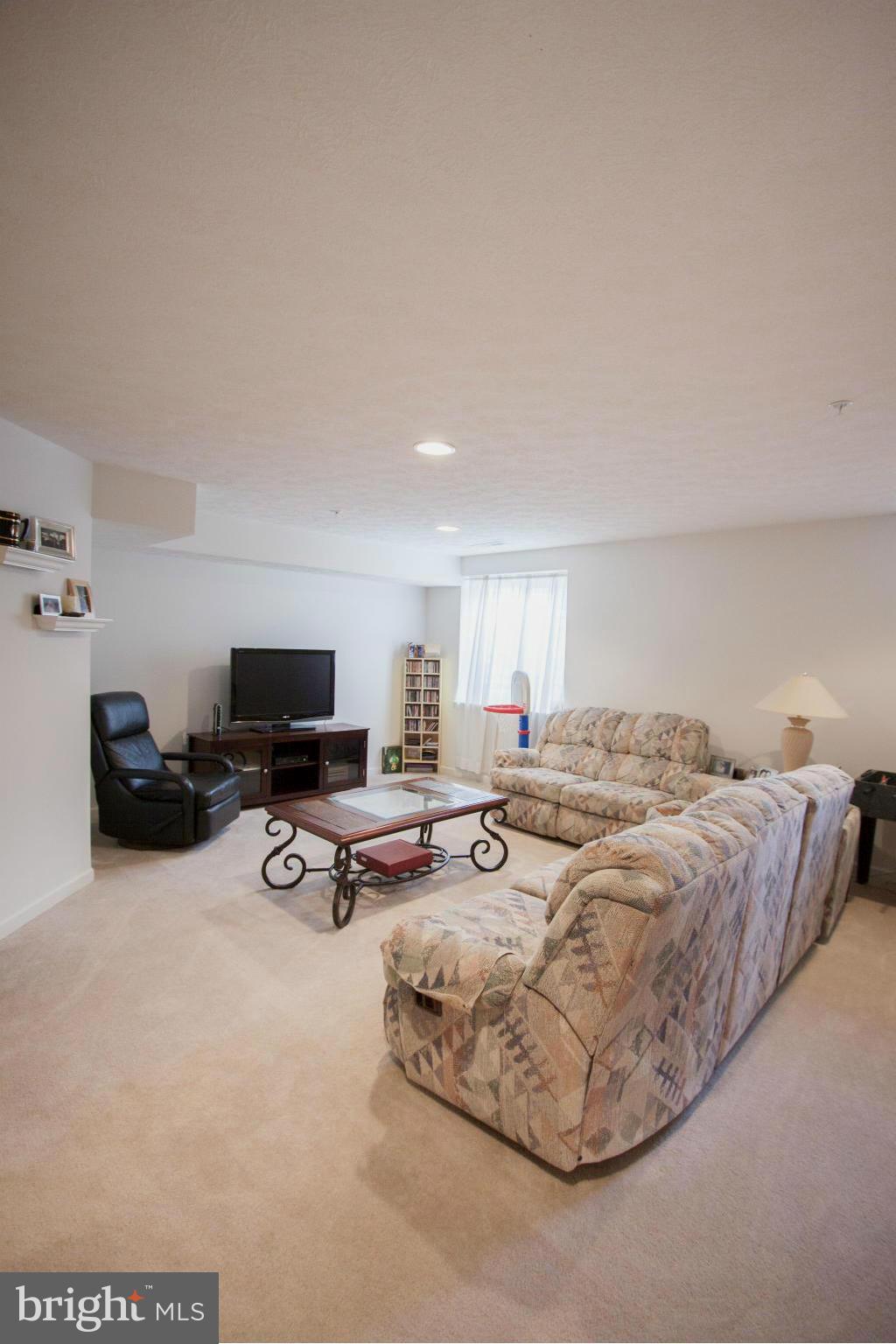 9653 Biggs Road Baltimore, MD 21220 - Photo 21 of 22 a view of a livingroom with furniture and a flat screen tv