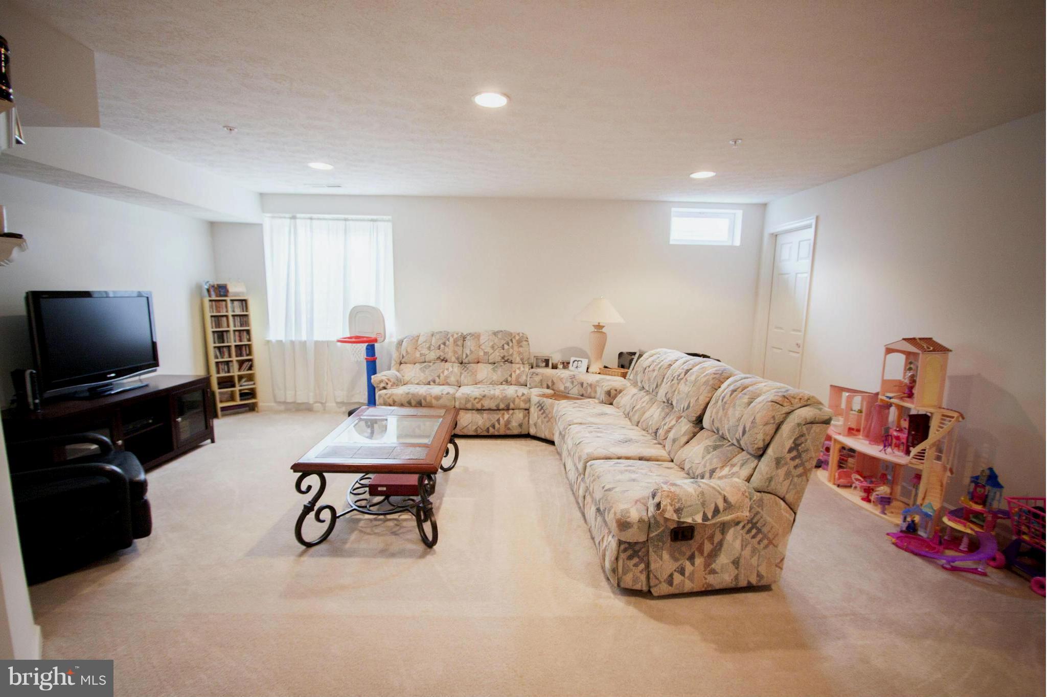 9653 Biggs Road Baltimore, MD 21220 - Photo 22 of 22 a living room with furniture and a flat screen tv