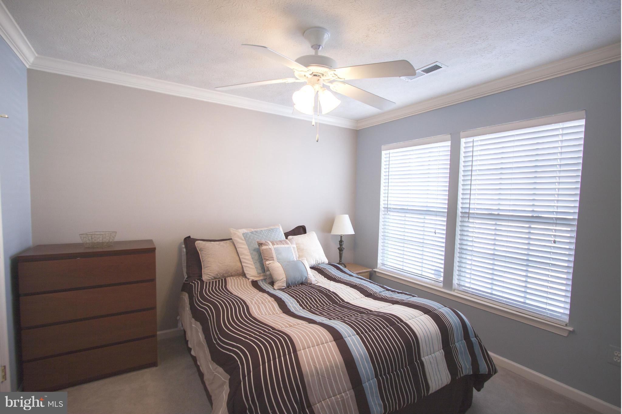 9653 Biggs Road Baltimore, MD 21220 - Photo 10 of 22 a bedroom with a bed and a window
