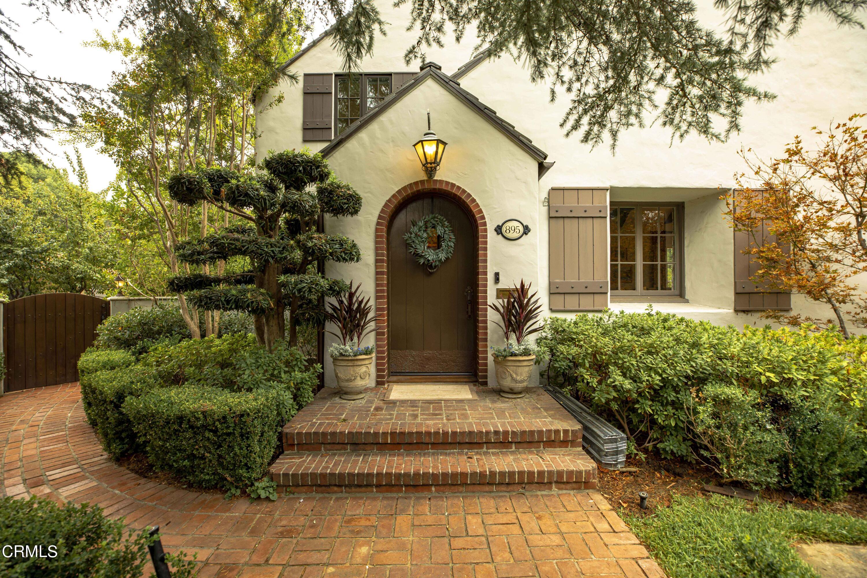 Undisclosed Address Pasadena, CA 91106 - Photo 2 of 40 a front view of a house with garden