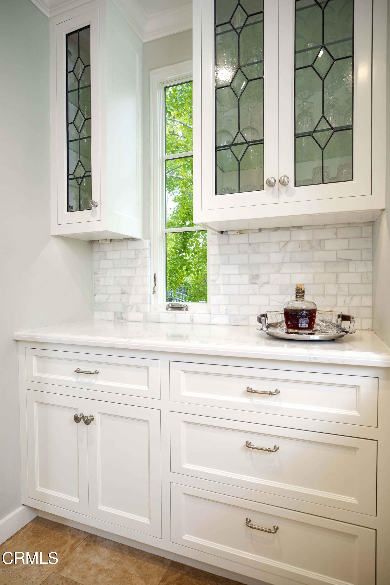 Undisclosed Address Pasadena, CA 91106 - Photo 15 of 40 a kitchen with white cabinets and a window