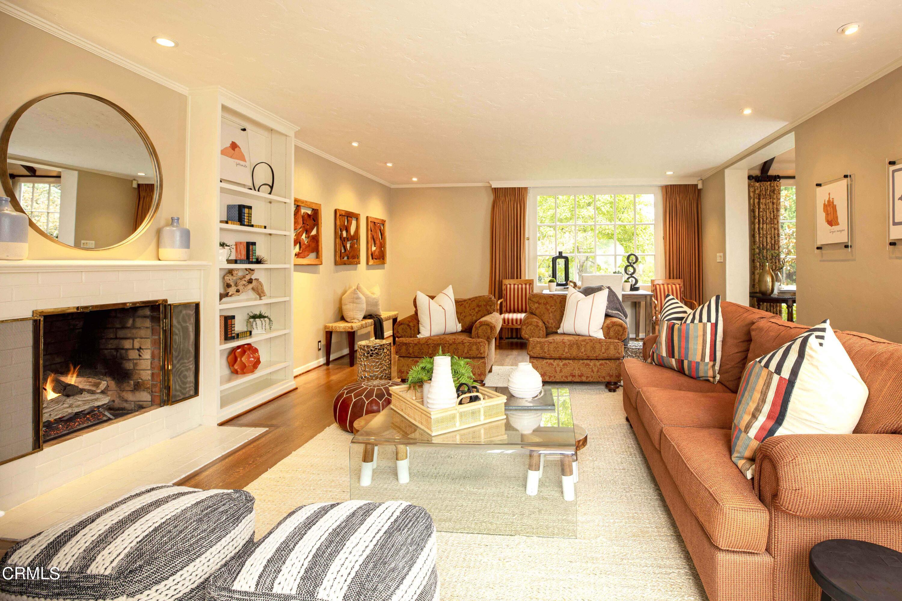 Undisclosed Address Pasadena, CA 91106 - Photo 19 of 40 a living room with furniture a fireplace and a large window