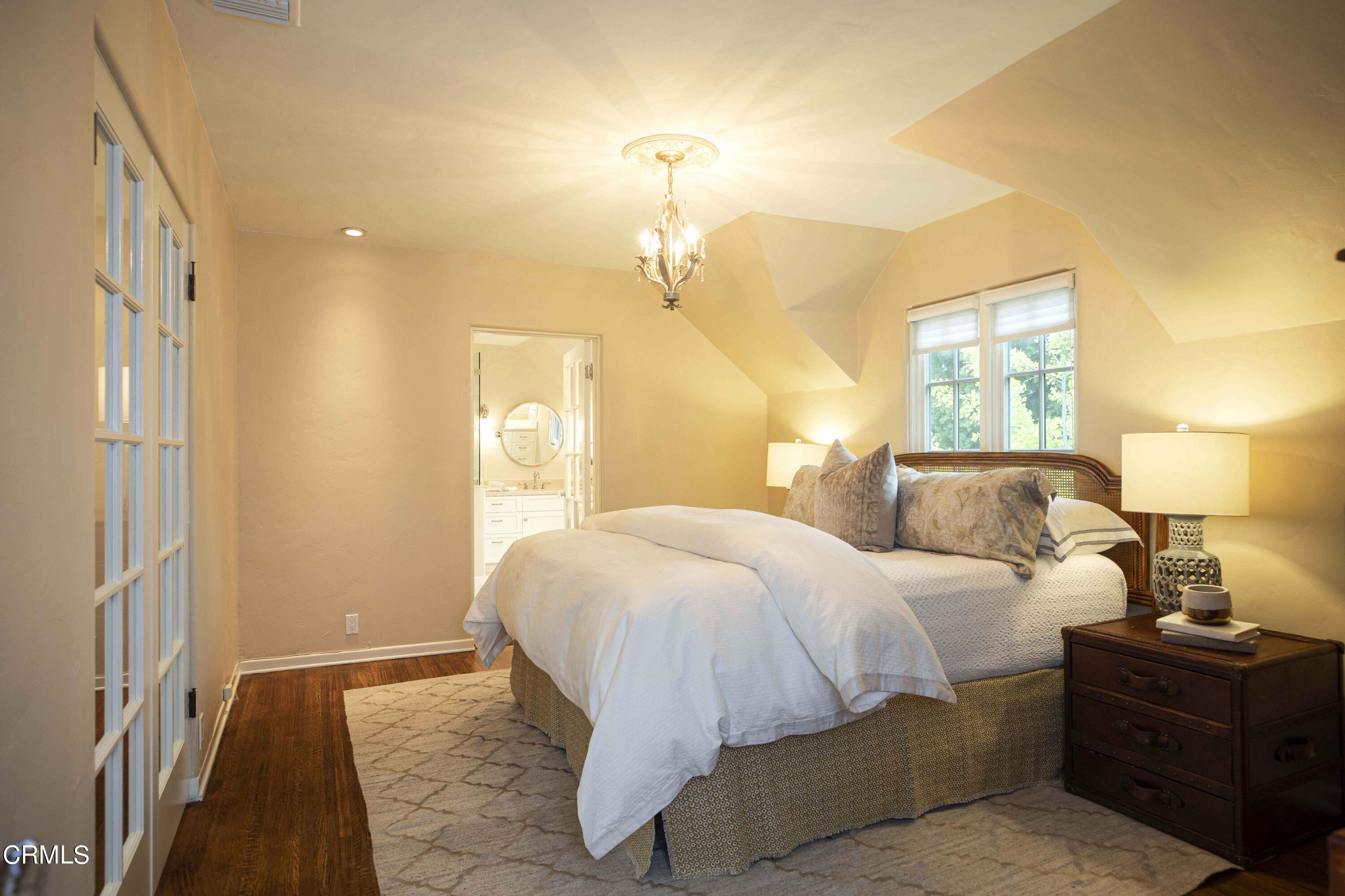 Undisclosed Address Pasadena, CA 91106 - Photo 23 of 40 a bedroom with a bed and wooden floor