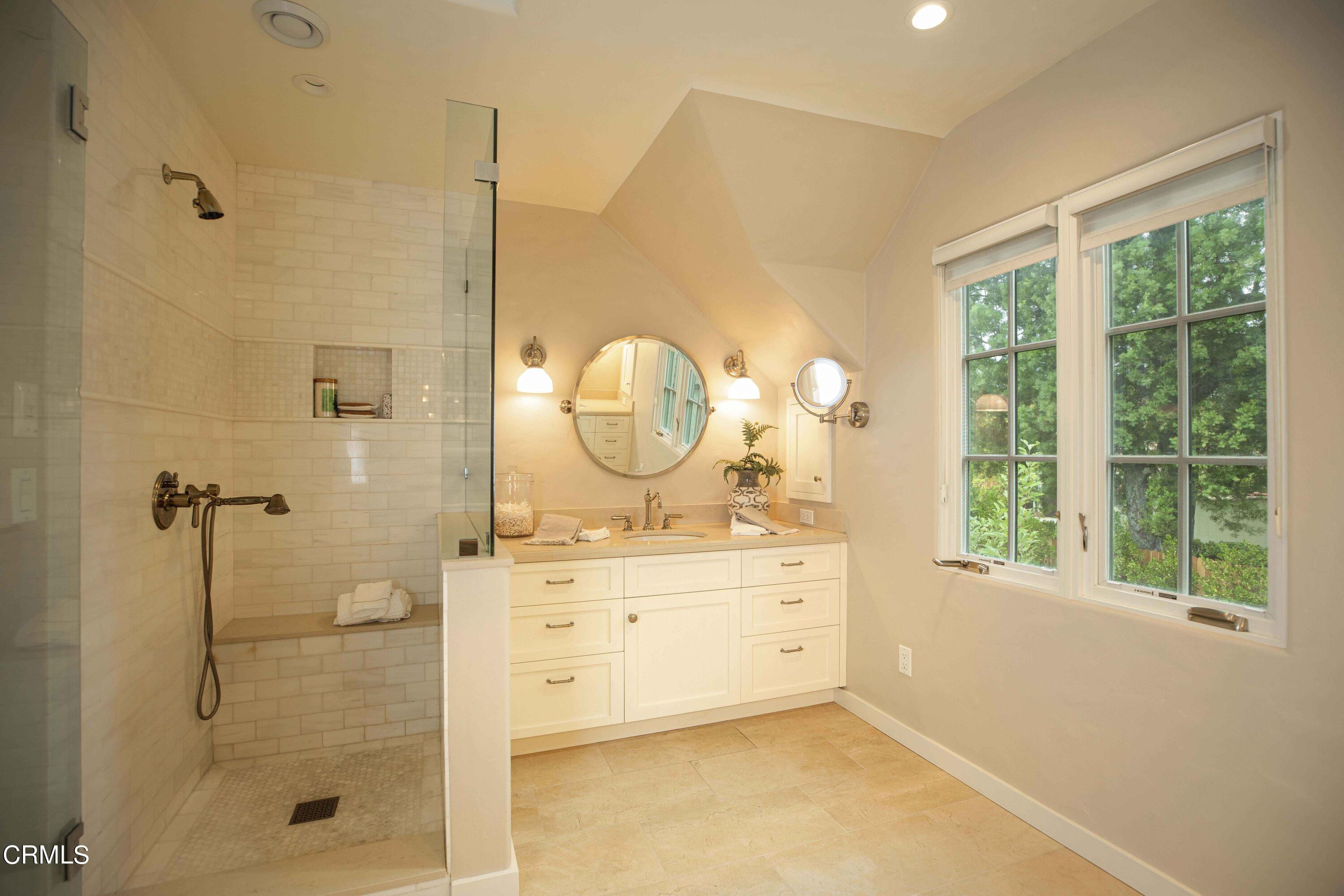 Undisclosed Address Pasadena, CA 91106 - Photo 24 of 40 a spacious bathroom with a mirror a shower and a sink