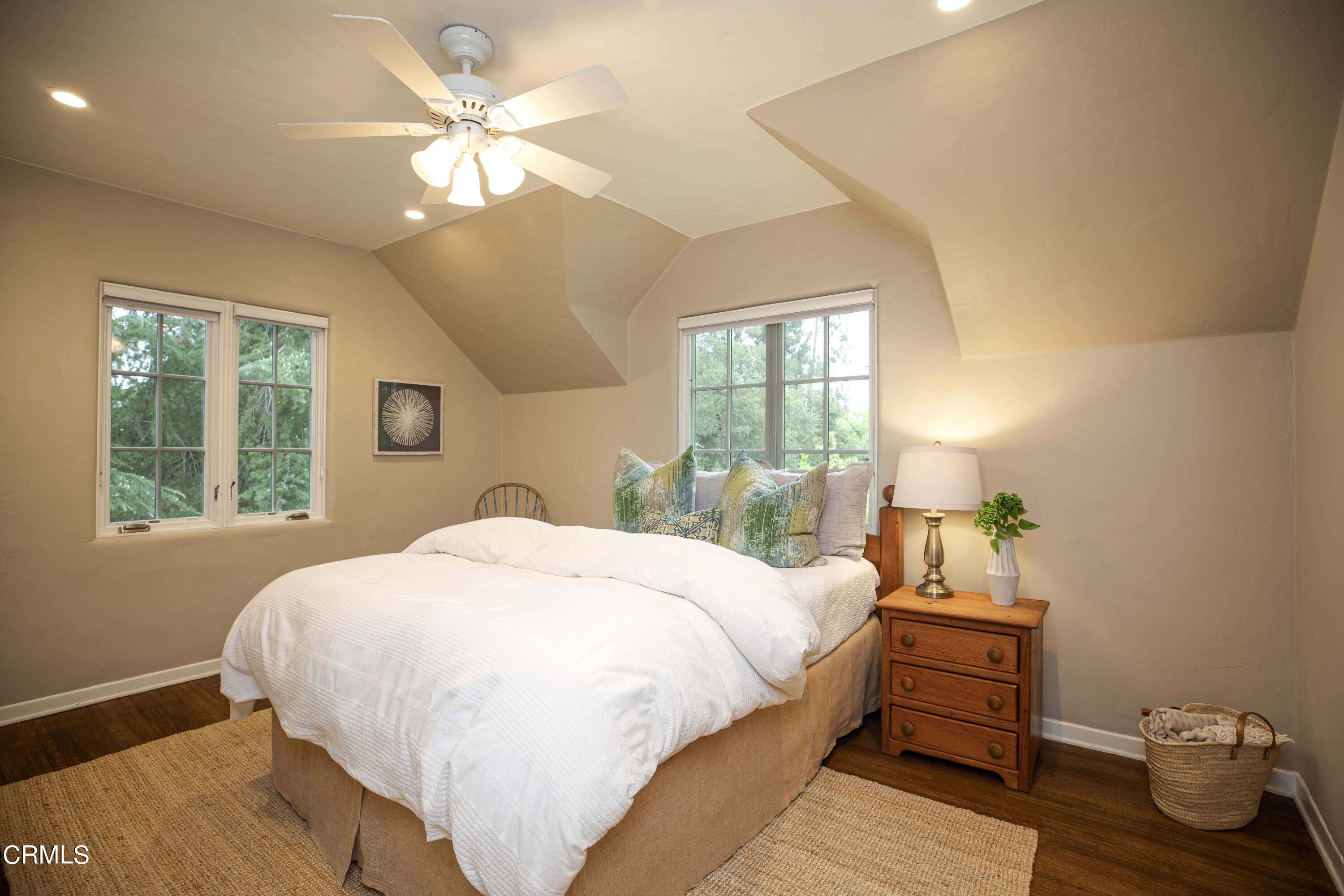 Undisclosed Address Pasadena, CA 91106 - Photo 26 of 40 a bedroom with a bed chandelier and a window