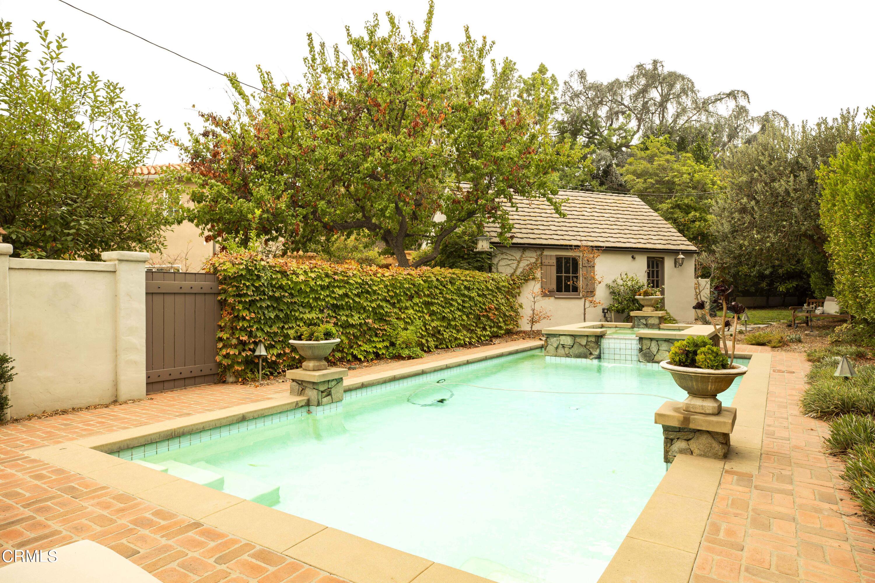 Undisclosed Address Pasadena, CA 91106 - Photo 30 of 40 a view of swimming pool with outdoor seating and trees in the background