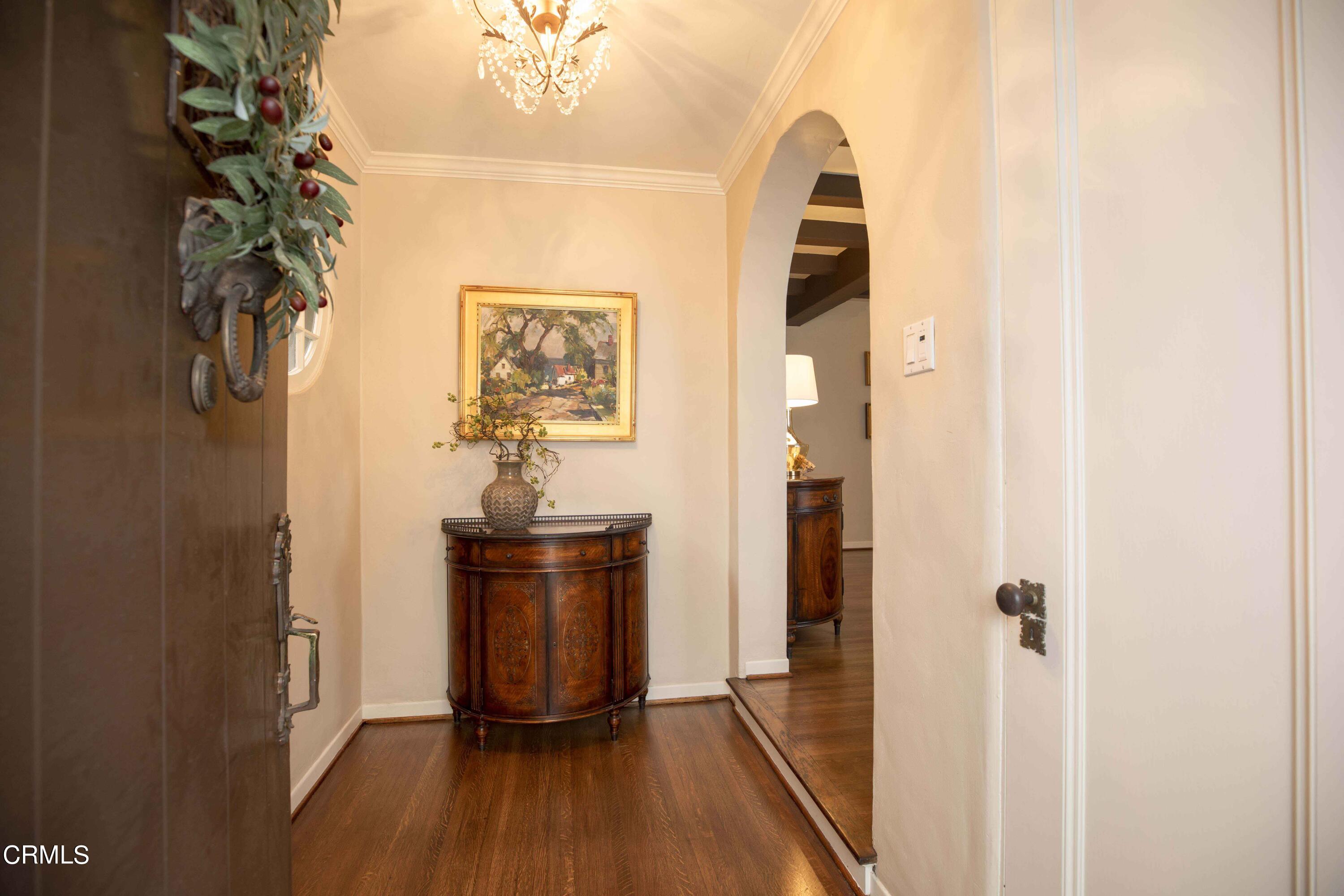 Undisclosed Address Pasadena, CA 91106 - Photo 4 of 40 a view of a hallway with wooden floor and entryway