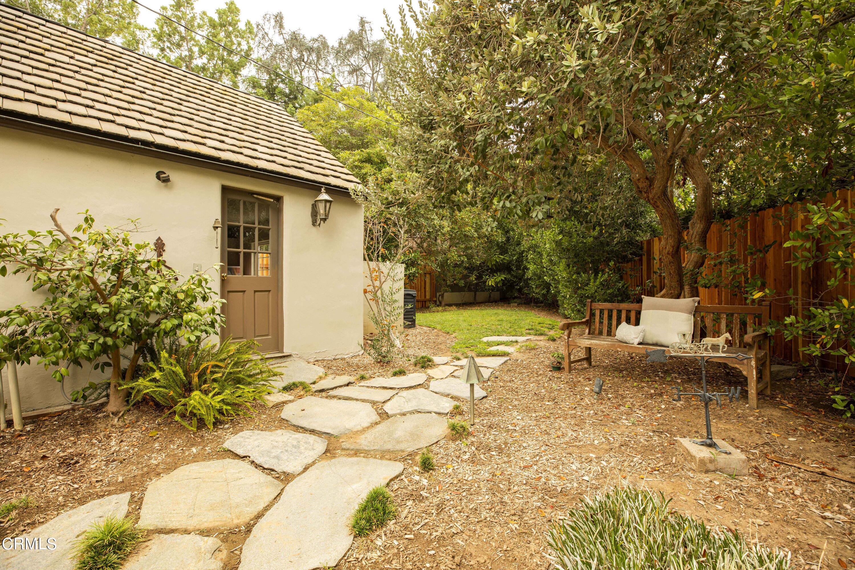 Undisclosed Address Pasadena, CA 91106 - Photo 34 of 40 a backyard of a house with table and chairs