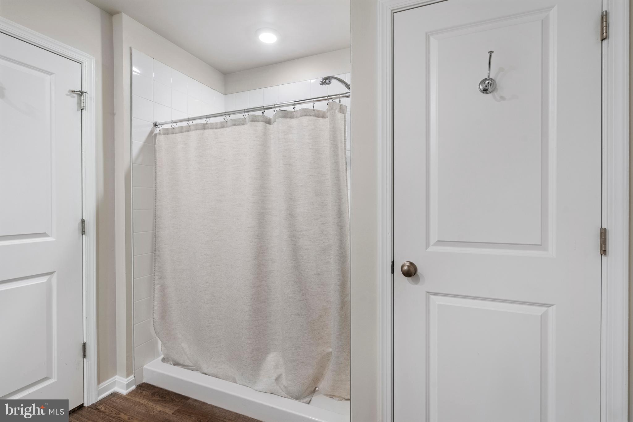 157 Lyon Rdg Road Shepherdstown, WV 25443 - Photo 20 of 28 a bathroom with a shower and a glass door