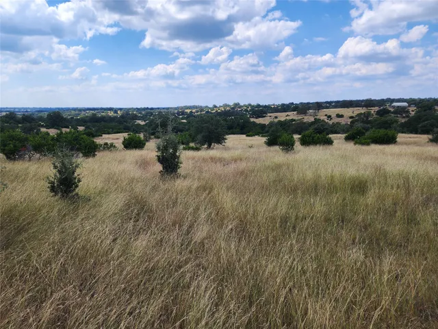 a view of a lake with a building in the background