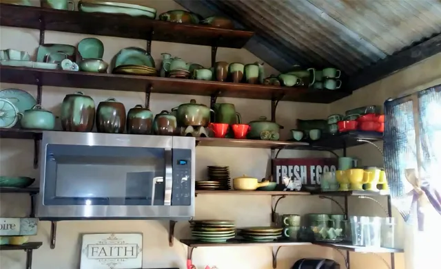 a view of walk in closet with clothes