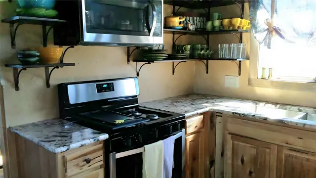 a aerial view of a house with a yard
