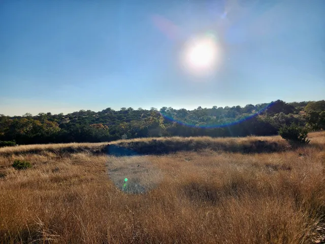 a view of lake with sunset