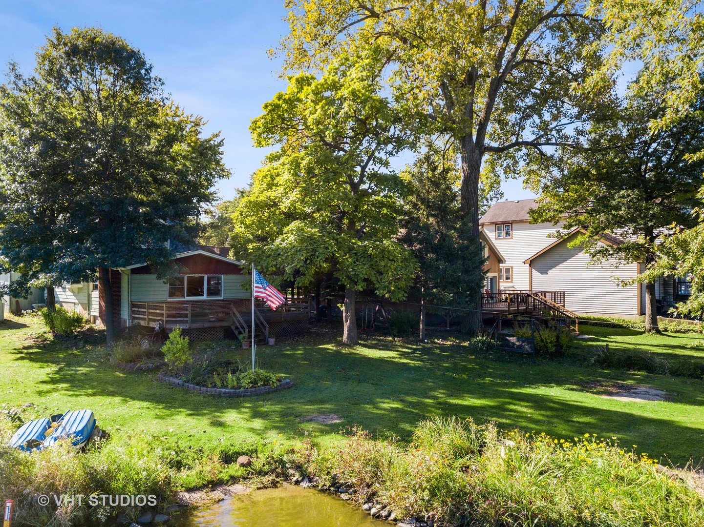 1200 Bayview Road Fox River Grove, IL 60021 - Photo 17 of 21 a front view of a house with garden