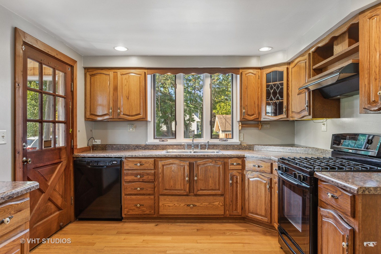 1200 Bayview Road Fox River Grove, IL 60021 - Photo 3 of 21 a kitchen with stainless steel appliances granite countertop a stove and a sink