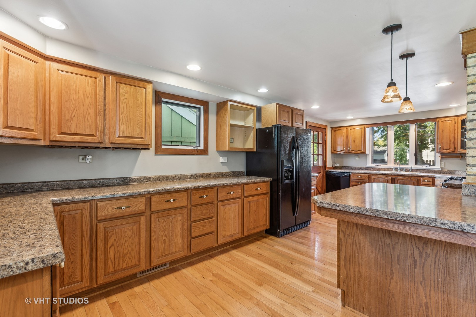 1200 Bayview Road Fox River Grove, IL 60021 - Photo 5 of 21 a kitchen with stainless steel appliances granite countertop a sink a stove and a refrigerator