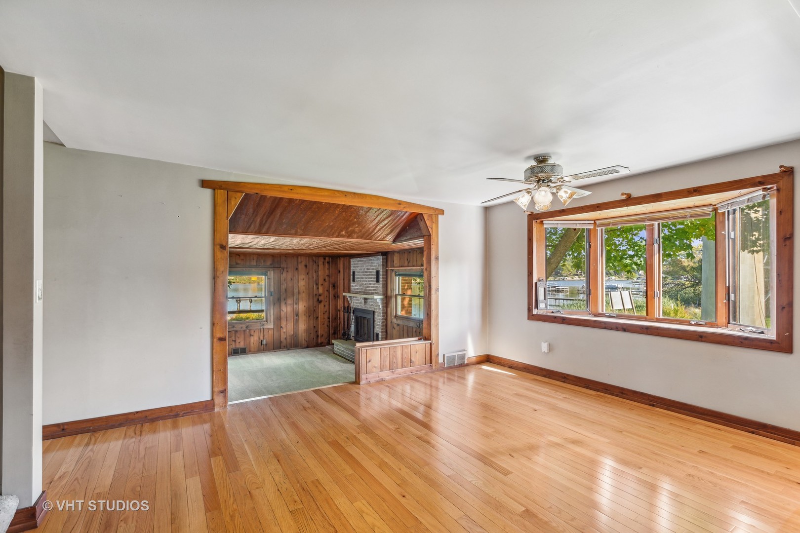 1200 Bayview Road Fox River Grove, IL 60021 - Photo 6 of 21 an empty room with wooden floor and windows