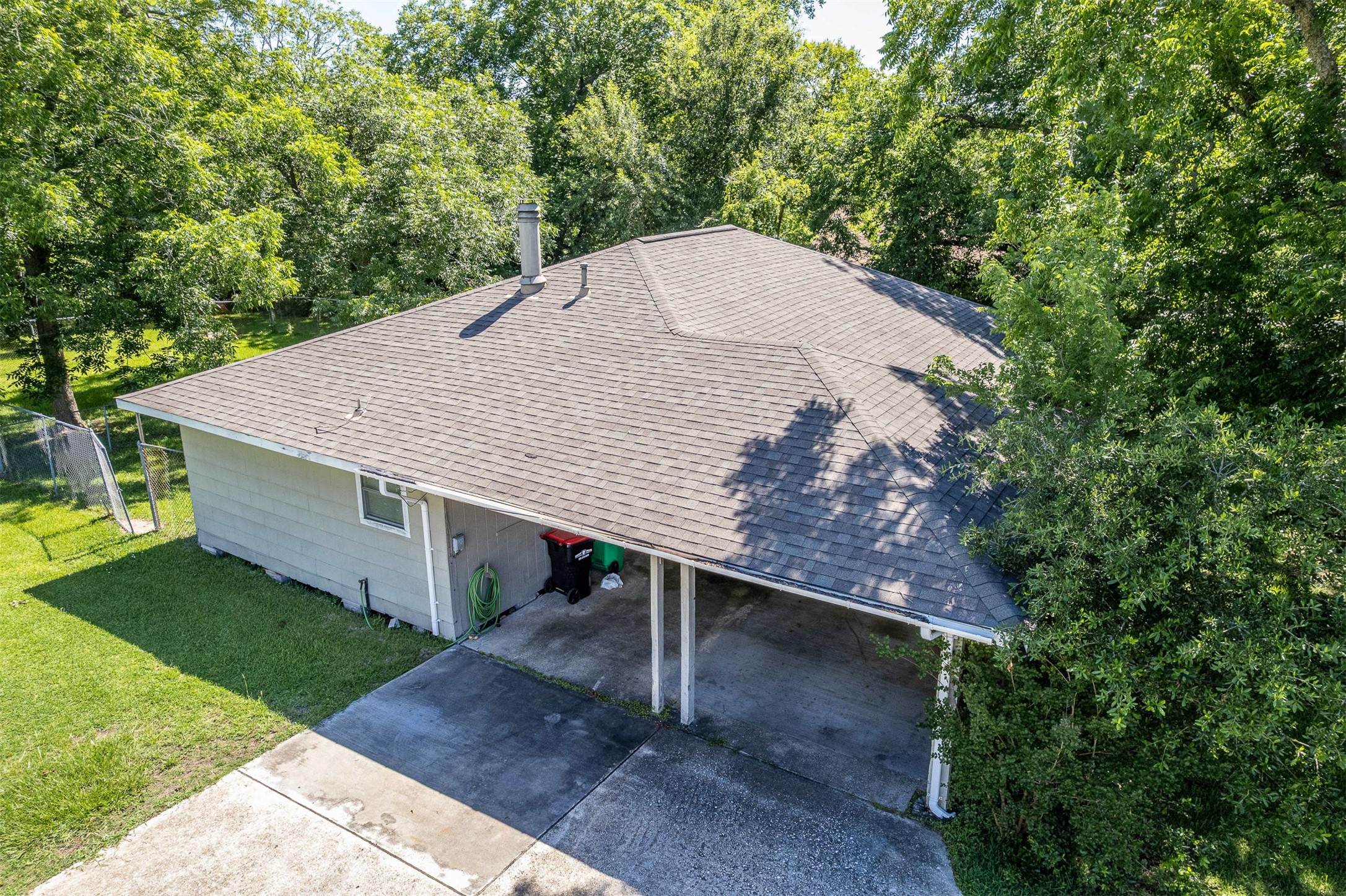 502 Massey Tompkins Road Baytown, TX 77521 - Photo 2 of 32 a view of a backyard with a small cabin