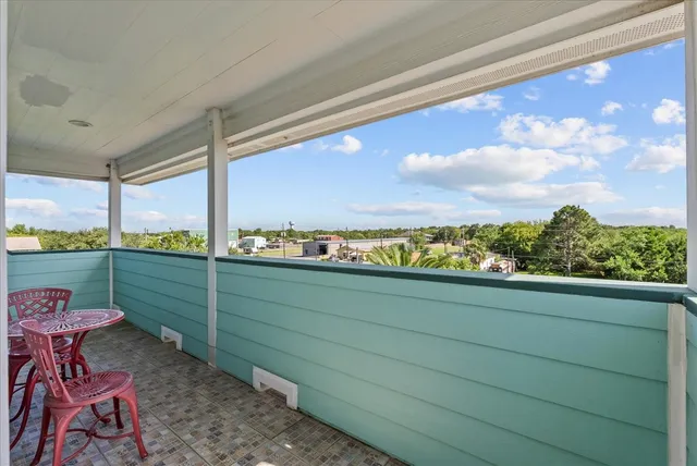 a view of a swimming pool with a yard