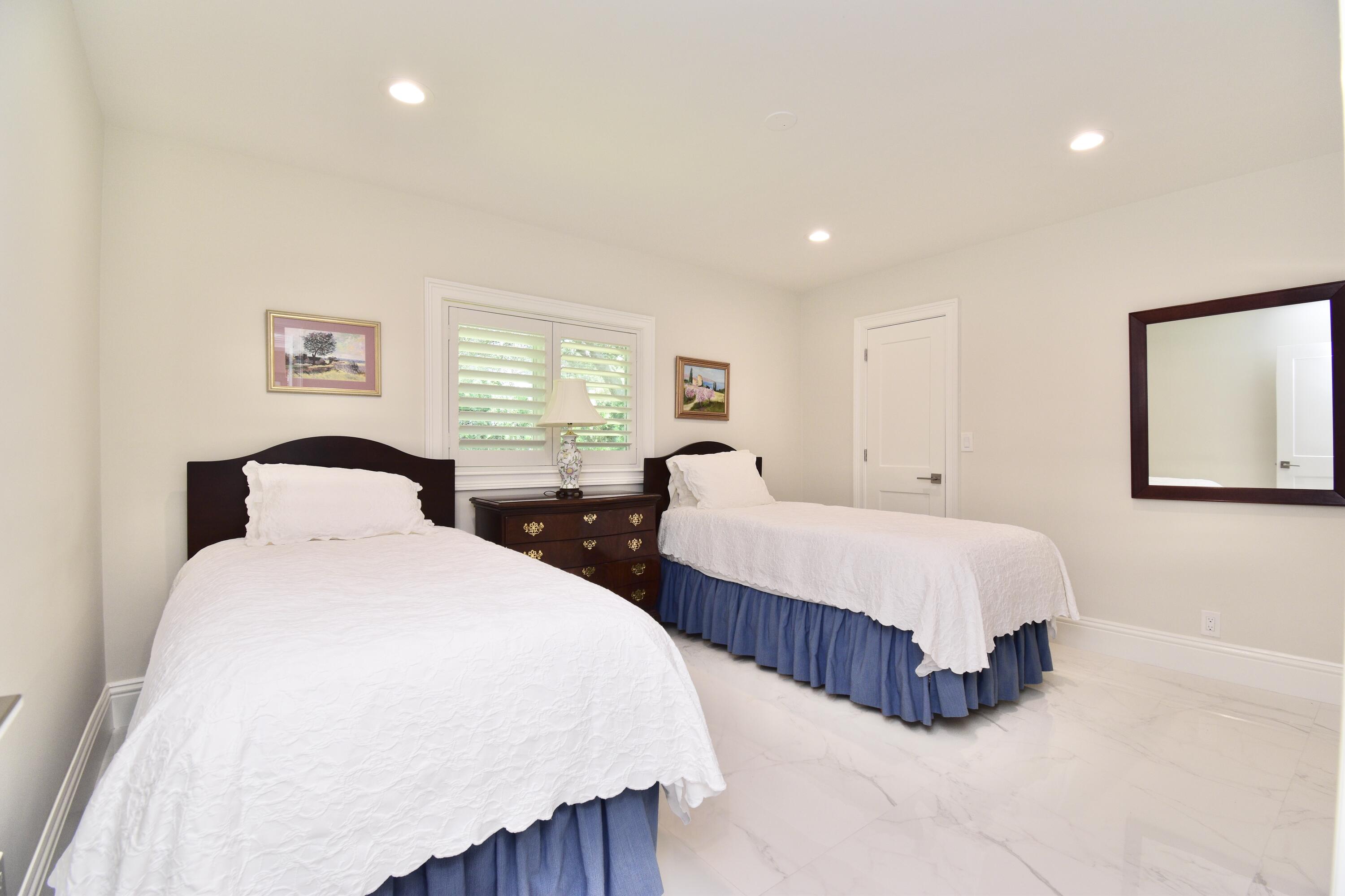 20954 Cipres Way Boca Raton, FL 33433 - Photo 48 of 65 a spacious bedroom with two beds and a large window