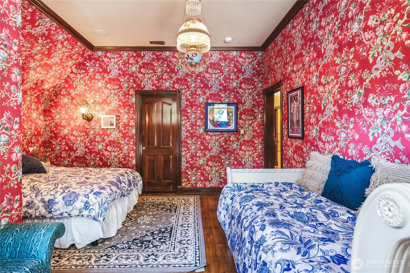 1656 Eagle Ridge Road Orcas Island, WA 98245 - Photo 26 of 40 a bedroom with a bed and a chandelier