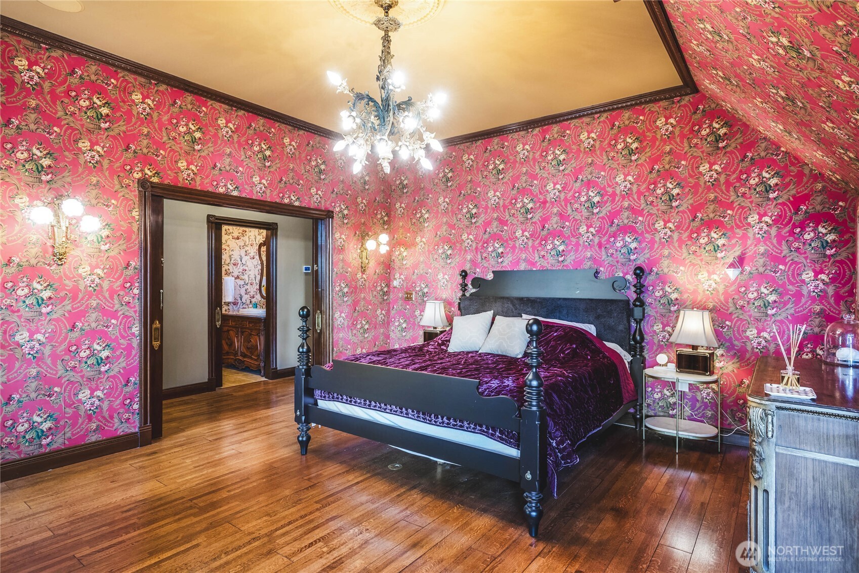 1656 Eagle Ridge Road Orcas Island, WA 98245 - Photo 29 of 40 a spacious bedroom with a bed and a chandelier