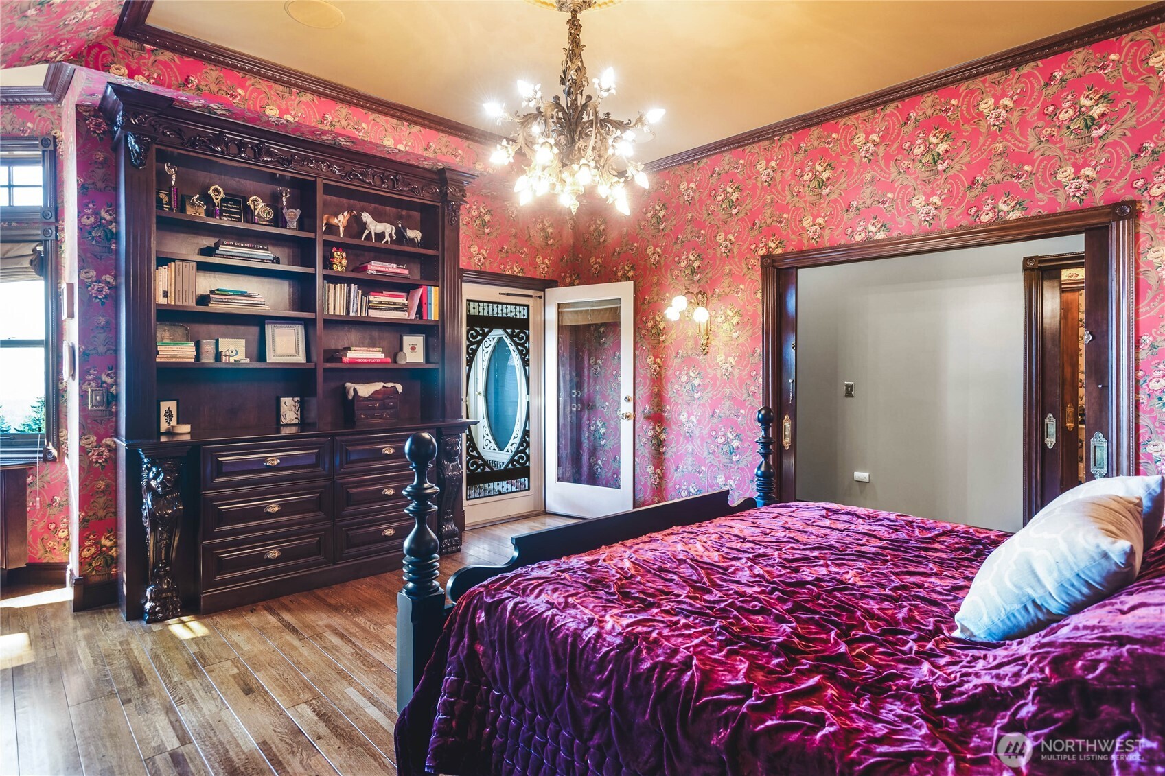 1656 Eagle Ridge Road Orcas Island, WA 98245 - Photo 30 of 40 a bedroom with a bed and a chandelier