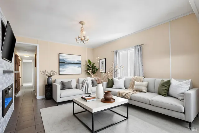 a living room with furniture a fireplace and a flat screen tv