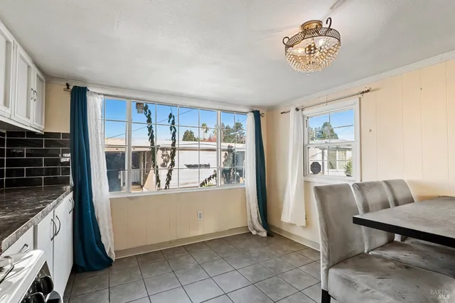 a view of kitchen with furniture stove and wooden floor