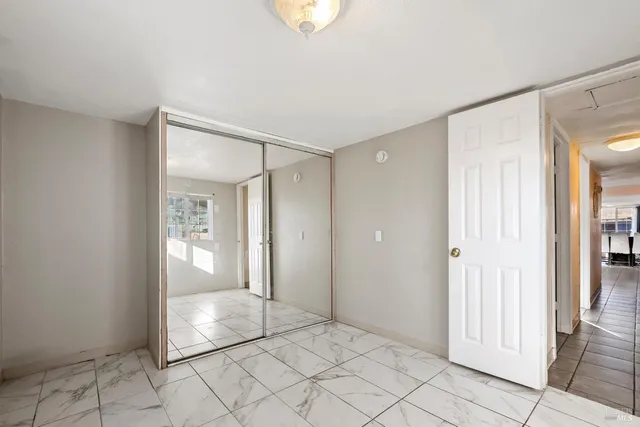 a view of an empty room and window