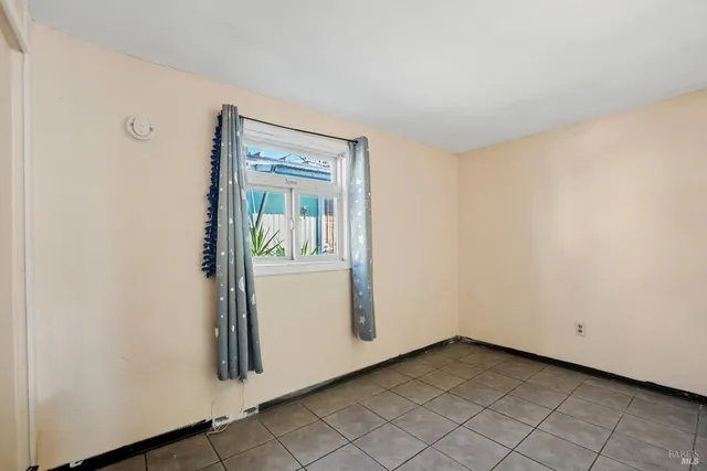 a front view of a house with a street