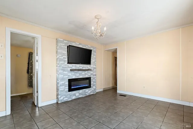 a view of an empty room with fire place