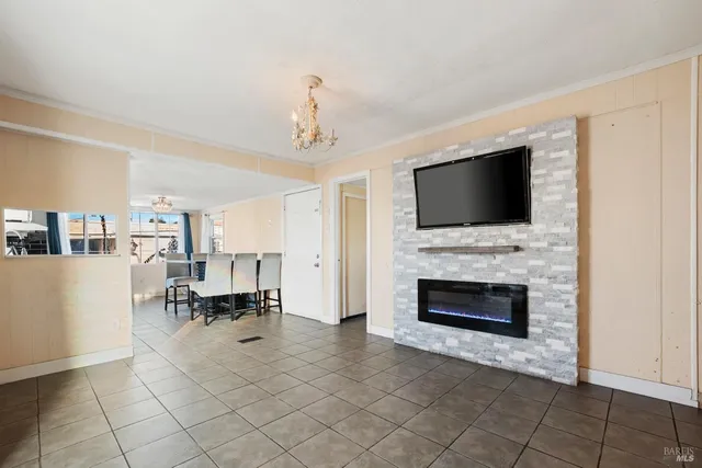a view of living room with furniture and flat screen tv