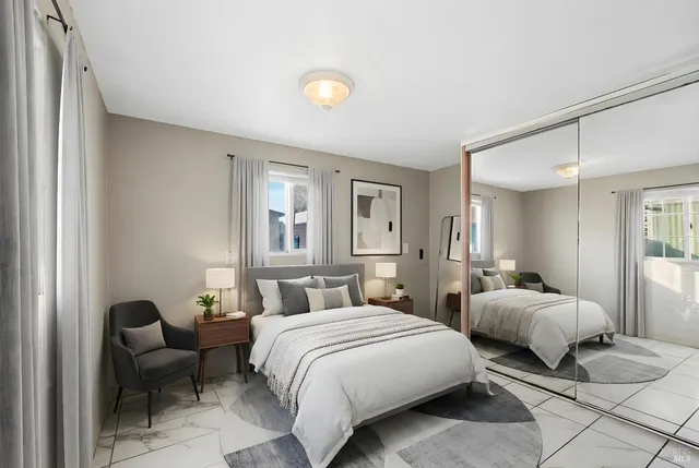 a bedroom with two beds and a couch