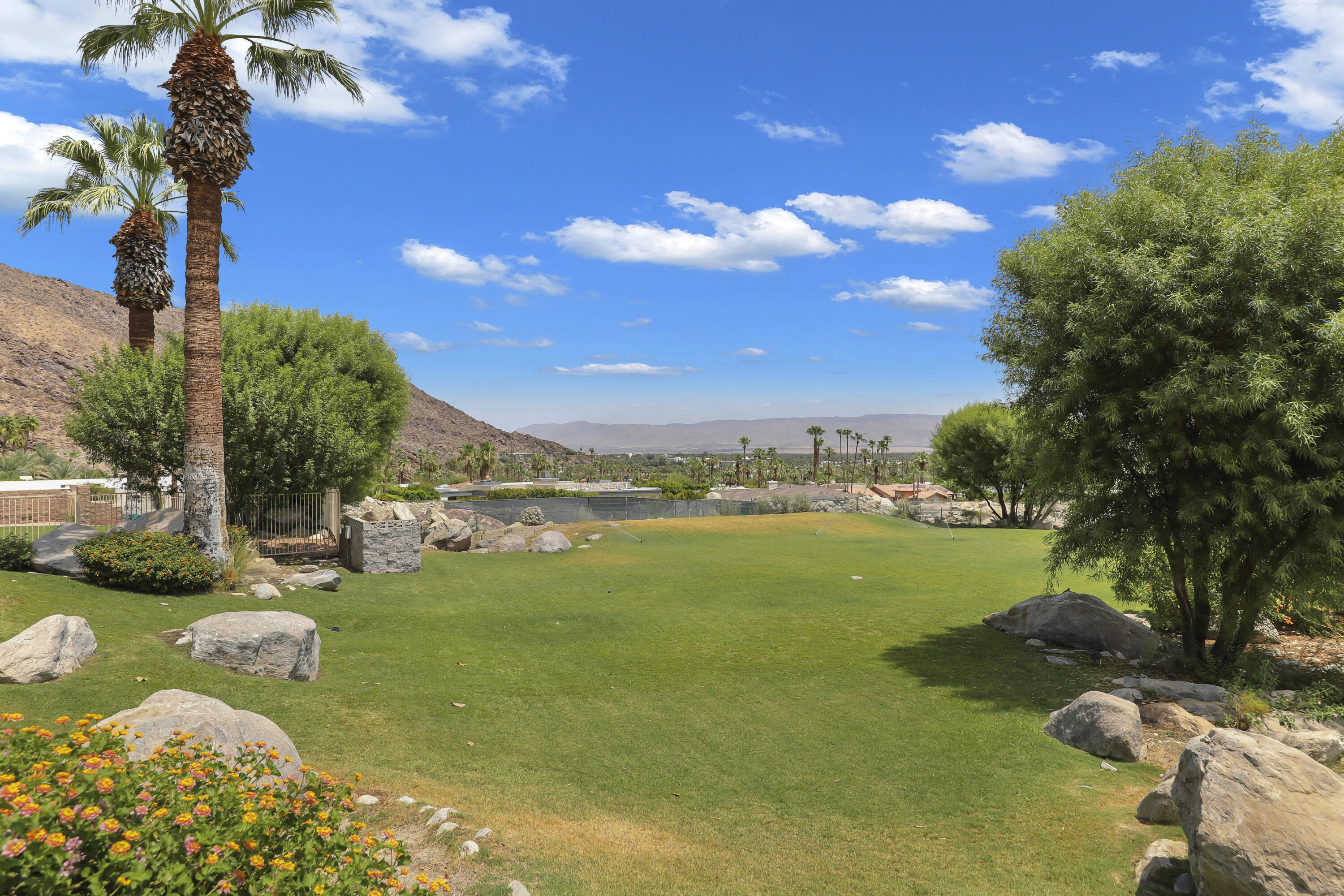 770 South La Mirada Road Palm Springs, CA 92264 - Photo 18 of 39 a view of a lake with a yard