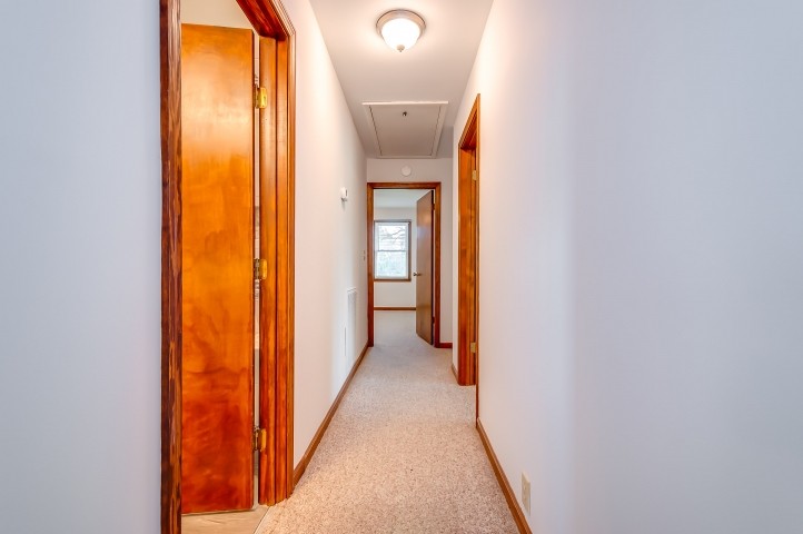 2148 Double Branch Road Columbia, TN 38401 - Photo 22 of 47 a view of a hallway with wooden floor and a bathroom