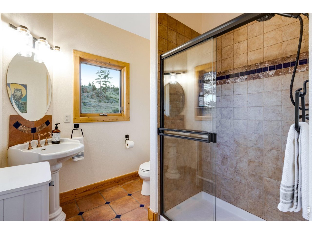 5433 North Rim Road Livermore, CO 80536 - Photo 35 of 50 bath, pedestal sink, tile flooring and backsplash and bidet with soft-close lid