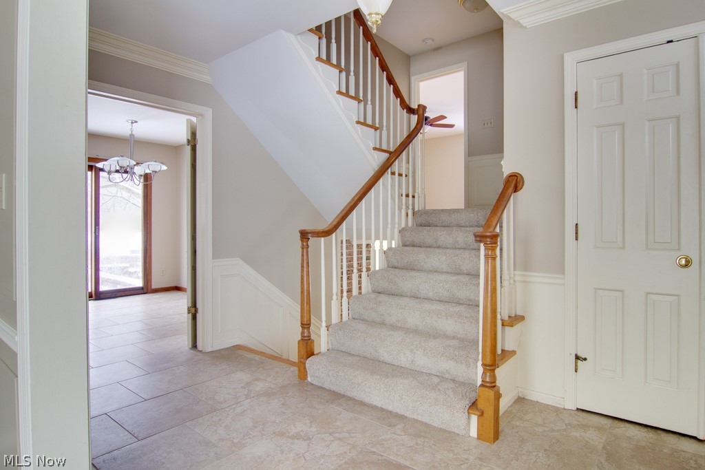 Turned staircase and spacious coat closet.
Wainscot, plaster crown molding. Unique 4 level open staircase.
