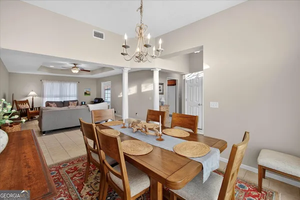 a large kitchen with stainless steel appliances granite countertop a sink stove and cabinets