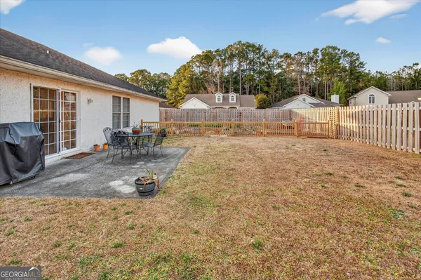 a view of backyard and tree