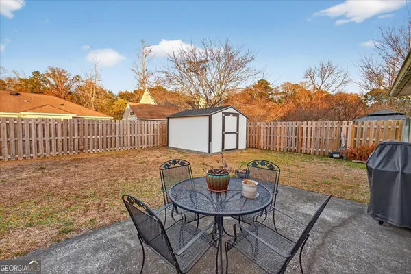 a view of garage and yard