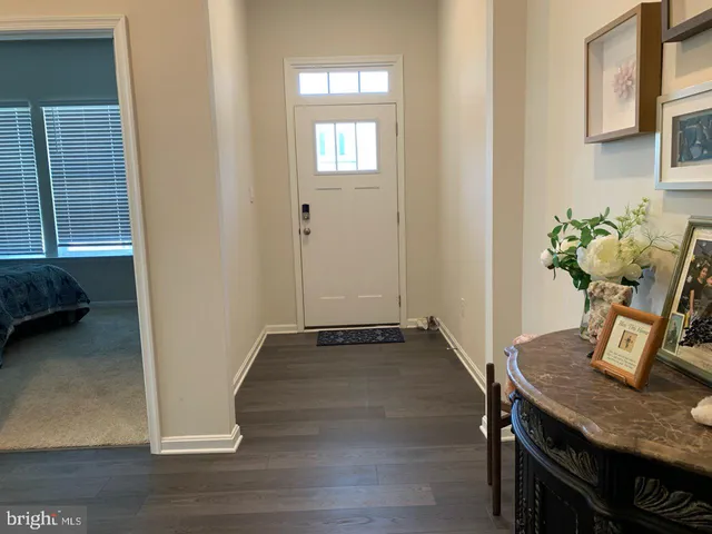 a view of kitchen with furniture and wooden floor