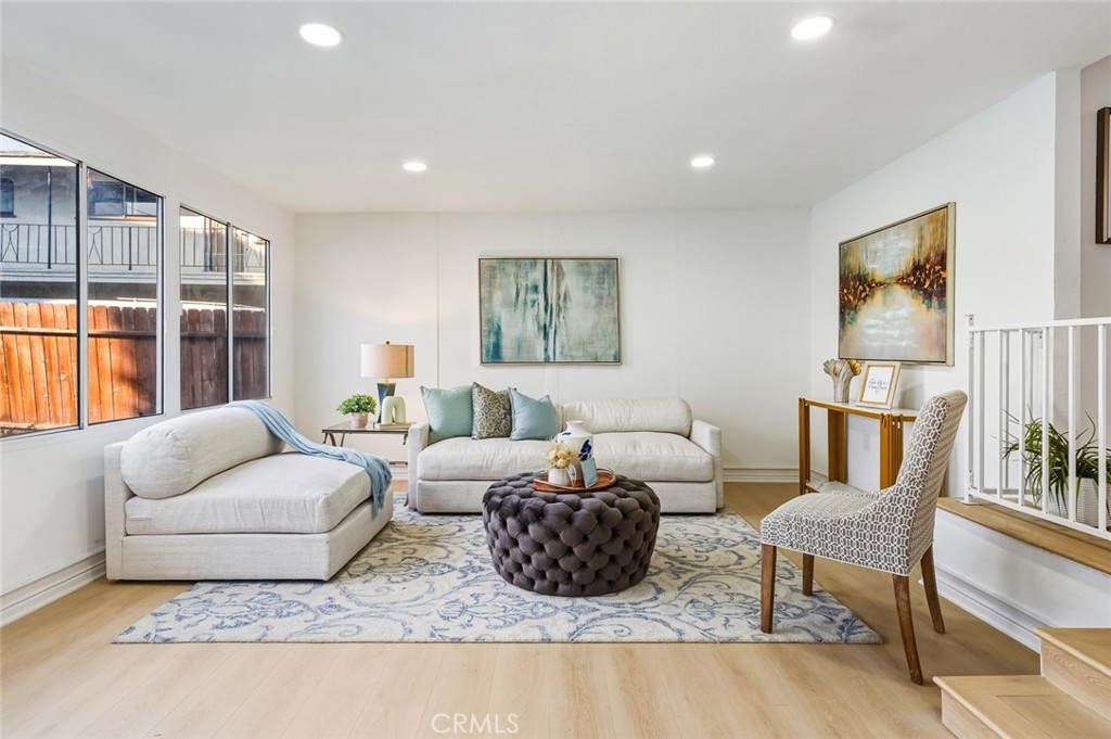 1065 Bennett Avenue Long Beach, CA 90804 - Photo 11 of 44 a living room with furniture and a large window with rug