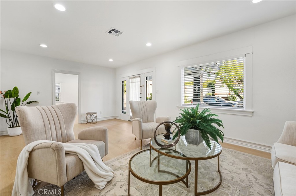 1065 Bennett Avenue Long Beach, CA 90804 - Photo 17 of 44 a living room with furniture and a potted plant